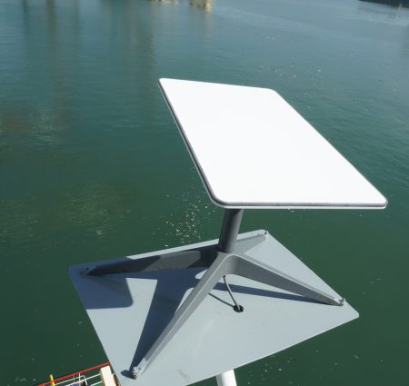 Kingston, Jamaica - 08 05 2024: Starlink antenna mounted on the wing of the bridge of a container ship moored in the port.